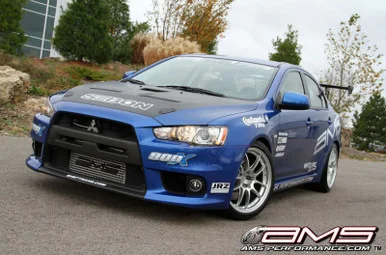 AMS Performance 08-15 Mitsubishi EVO X Front Mount Intercooler w/Modular Cast End Tanks & Logo – AMS.04.09.0001-1